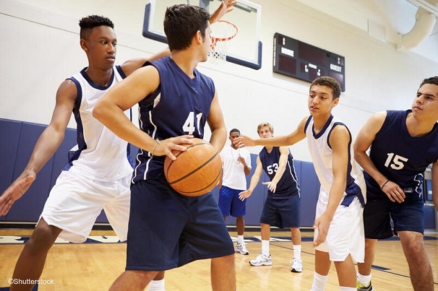 Teens playing basketball