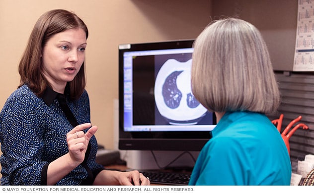 A doctor discusses treatment options with a patient.