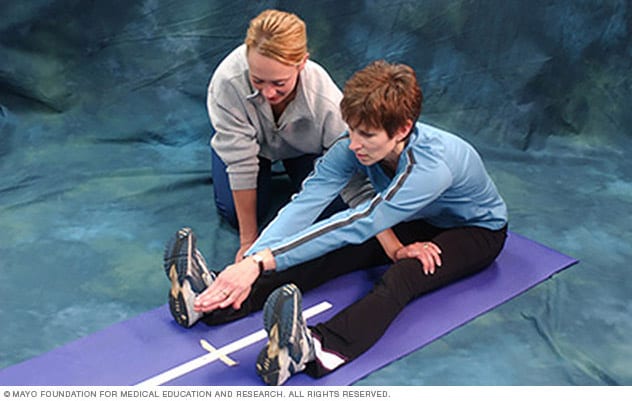 Woman doing sit-and-reach test 