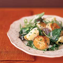 Seared scallops with new potatoes and field greens