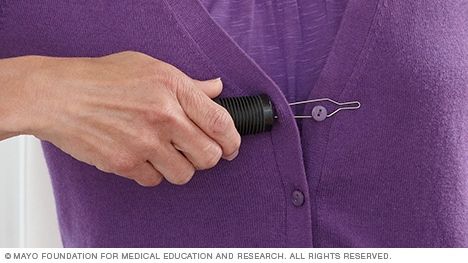Photo of a device that helps button clothes.