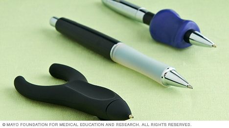 Photo showing a variety of pens designed to reduce stress on finger and thumb joints.