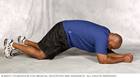 Man doing modified plank core-strength exercise