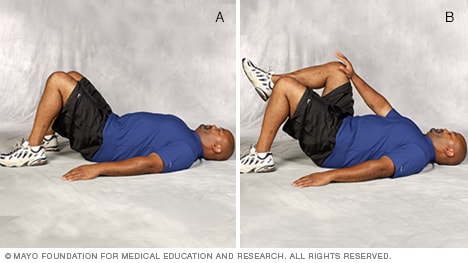 Man doing single-leg abdominal press core-strength exercise