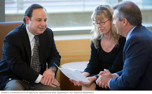 A group of doctors and staff having a discussion.