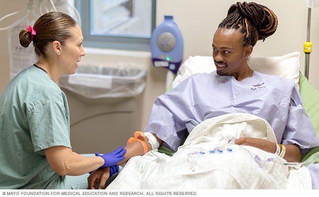 Care team works with patient