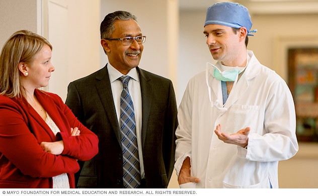 A team of doctors and staff in a discussion.