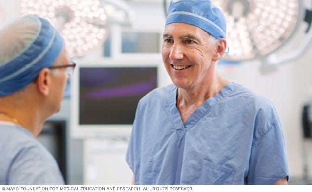 Two surgeons in a discussion in an operating room.