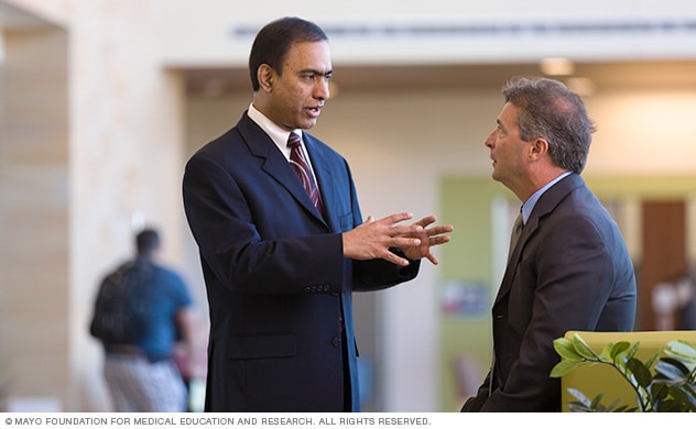 A doctor and a surgeon in a discussion