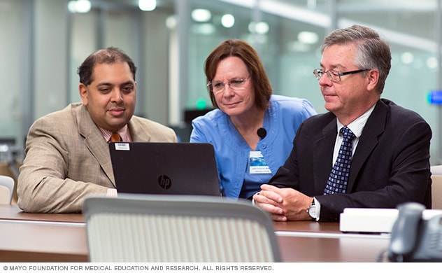 Physicians and nurse talking