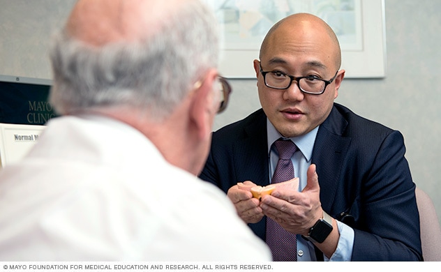 Surgeon consults with prostate cancer patient