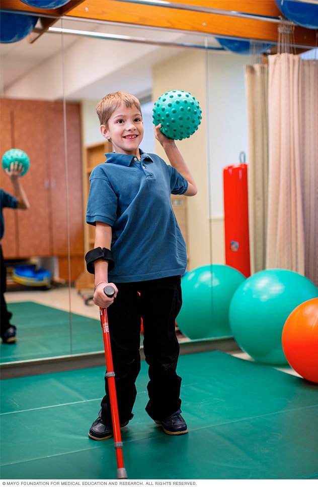 A boy during a physical therapy session