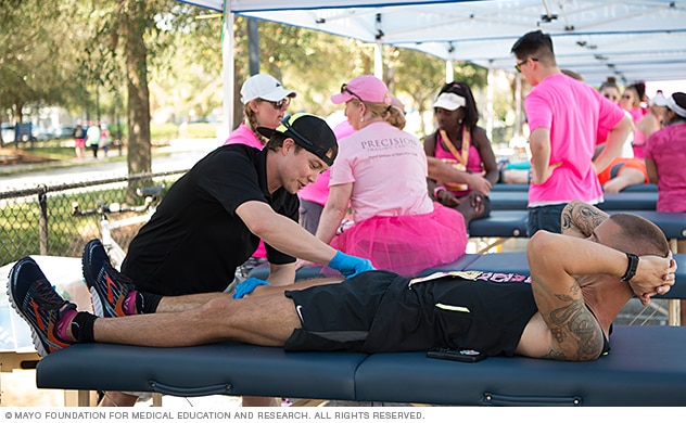 Mayo Clinic medical personnel provide medical aid to runners at the DONNA National Marathon to Finish Breast Cancer in Florida.