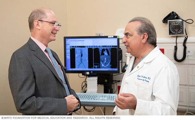 Members of the vascular team discuss a care plan.