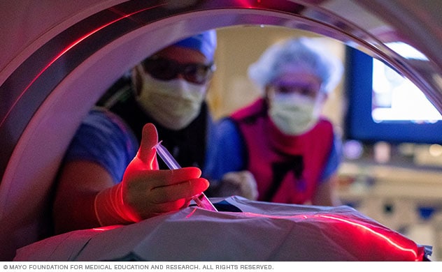 A patient undergoes an image-guided therapy.