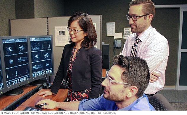 Doctors review a patient's images.