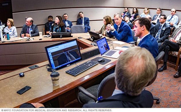 The thoracic tumor board meets regularly to discuss each new case