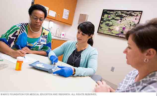 Program staff demonstrate medication management.