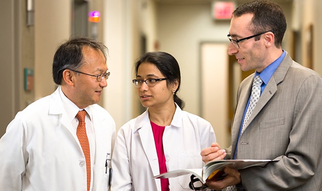 Mayo Clinic doctors confer with one another.