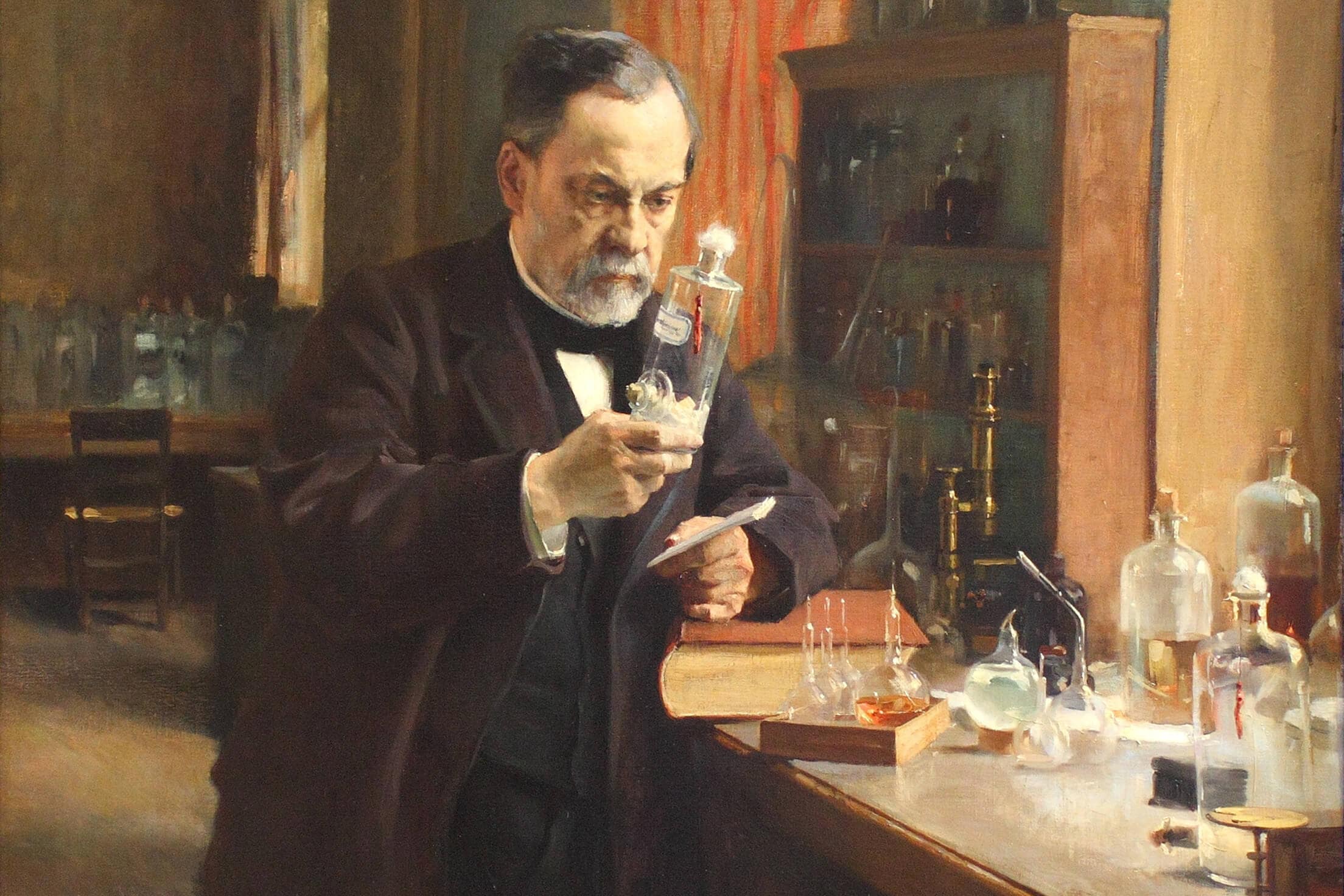  Dr. Louis Pasteur standing in his lab holding a bottle