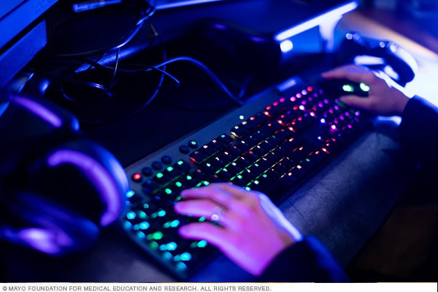 A person's hands on a keyboard