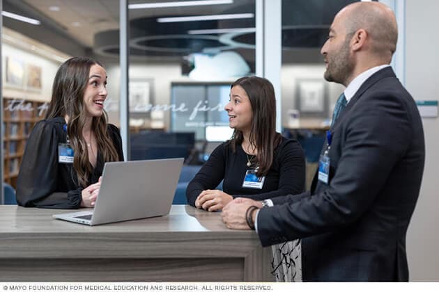 Mayo Clinic doctors consult at a standing desk.