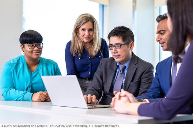 The breast cancer surgery team works together to optimize a care plan.