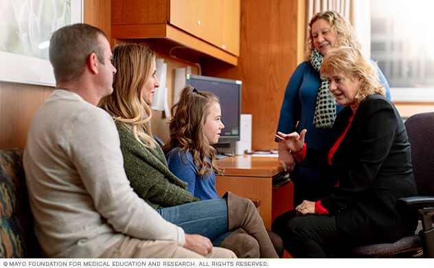 Mayo Clinic specialists consult with a family.