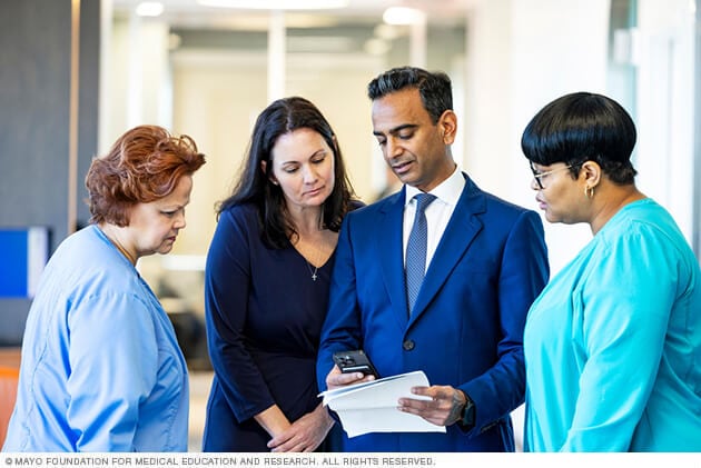 Mayo Clinic Melanoma Surgical Oncology team members collaborate on a patient care question.