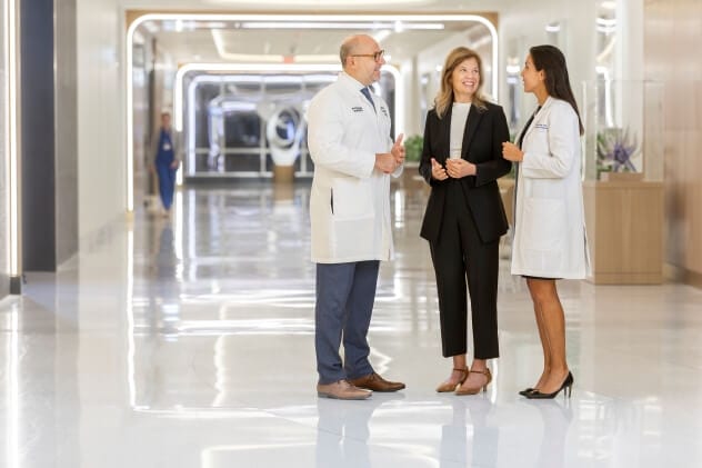Bariatric Center physicians chat in a hallway.