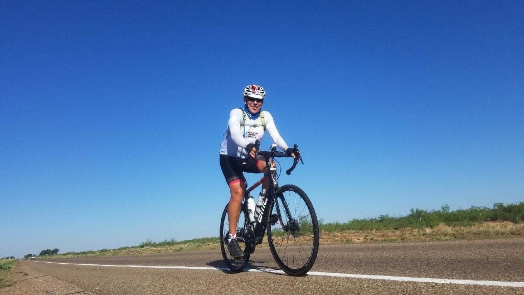 Christopher-Edgerton-cycling-on-the-open-road-1024x576.jpg