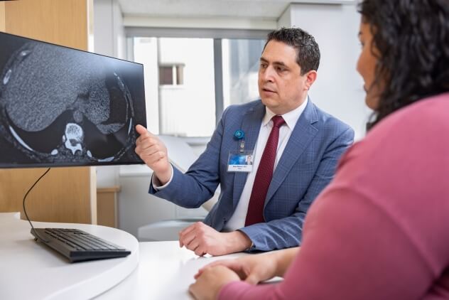 A Mayo Clinic surgeon discusses weight loss options with a patient.