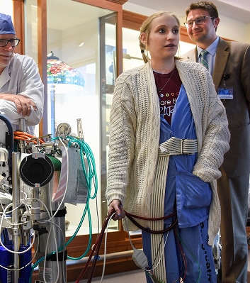 Young female patient walking after a heart-lung transplant