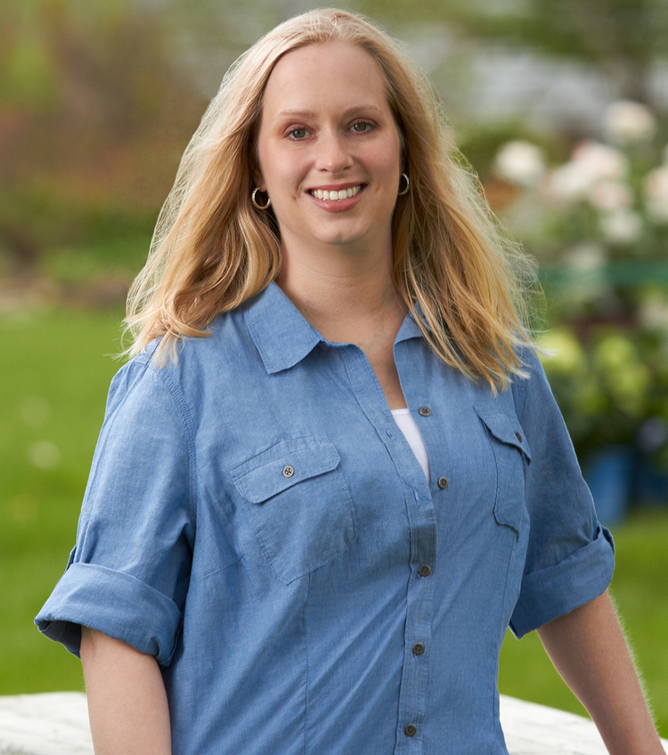 Blonde woman wearing a blue shirt