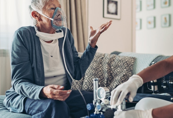 Patient speaking with a nurse while receiving treatment