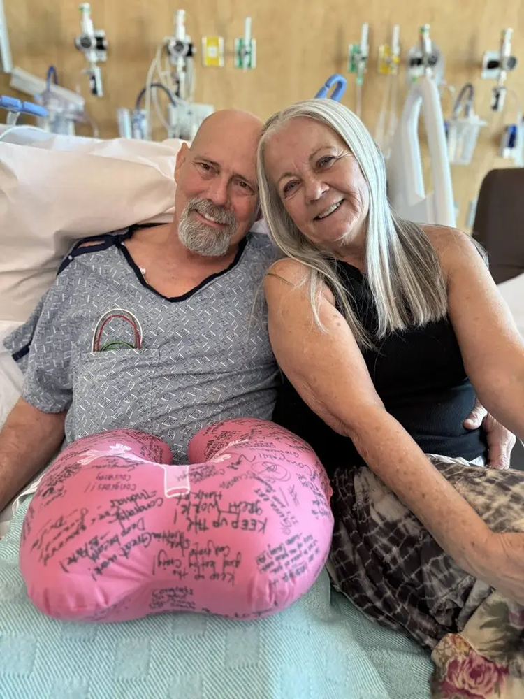 Male patient and his wife smiling.