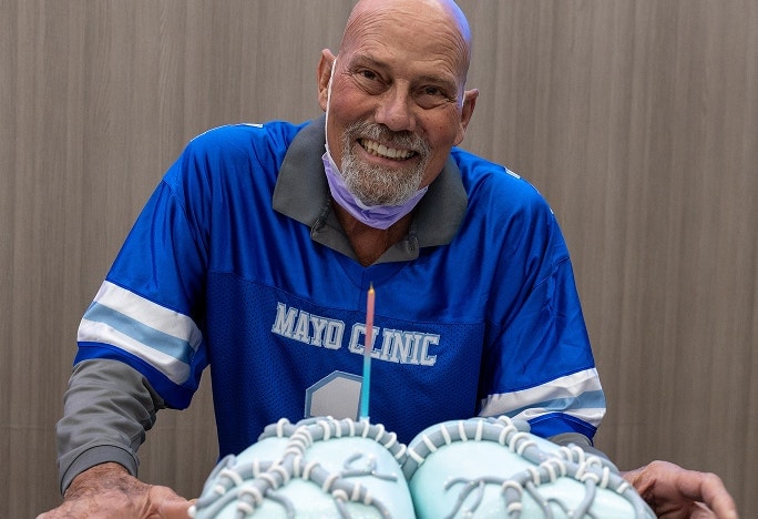 Man wearing a blue Mayo Clinic jersey